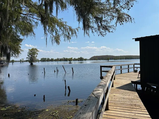 swimming pool view with a lake view