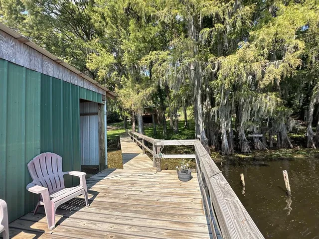 a view of a chairs and tables on the balcony
