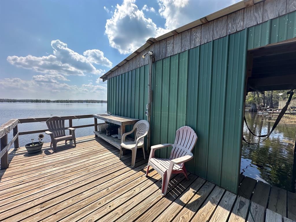 229 County Road Jefferson, TX 75657 - Photo 34 of 40 a balcony with hardwood filled with furniture and wooden floor