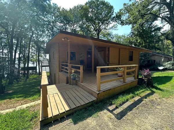 a view of a backyard with sitting area