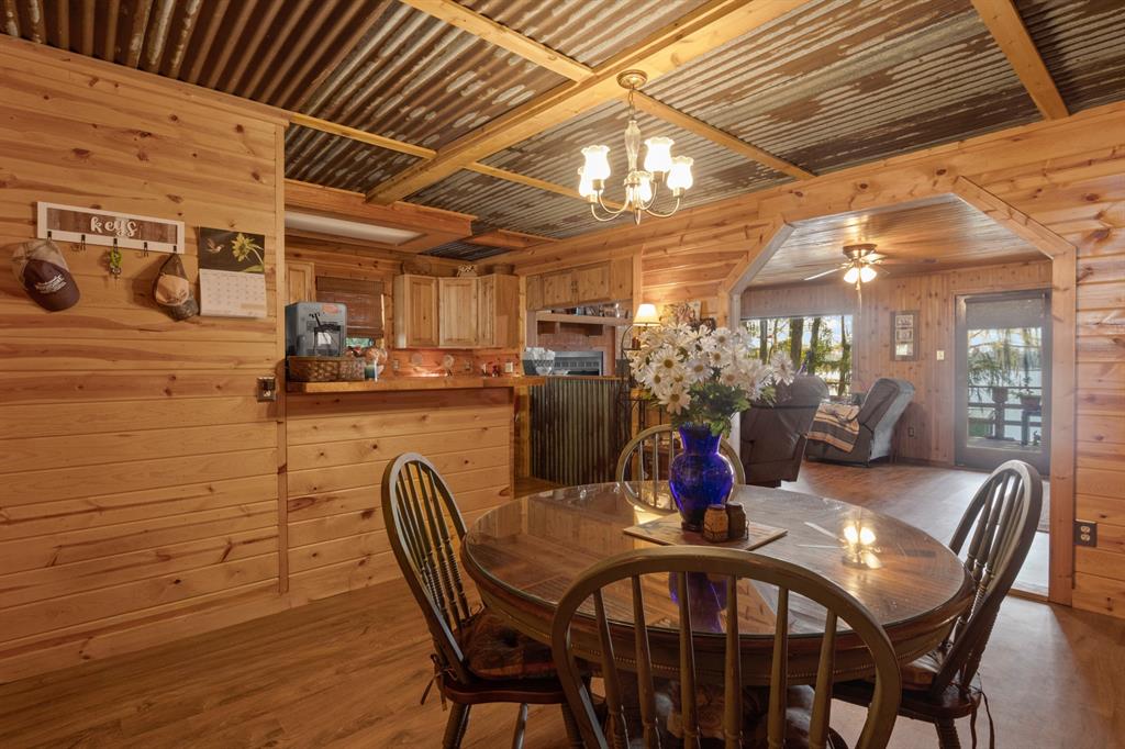 229 County Road Jefferson, TX 75657 - Photo 9 of 40 a view of a dining room with furniture