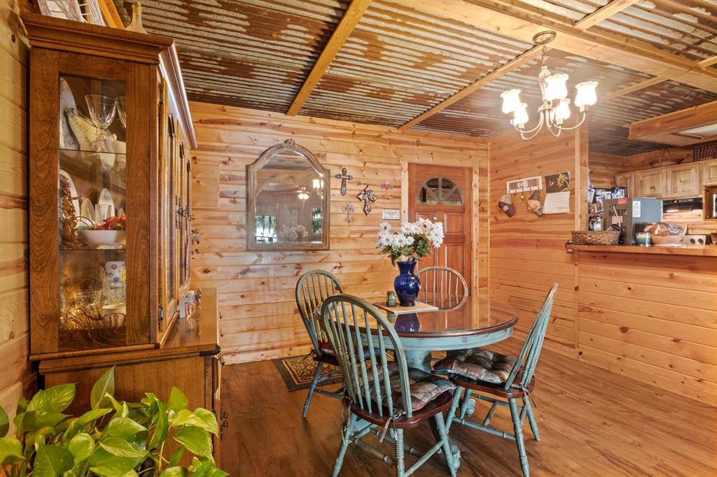 229 County Road Jefferson, TX 75657 - Photo 10 of 40 a view of a dining room with furniture and chandelier