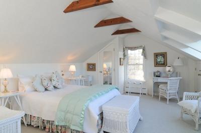 138 Stage Island Road Chatham, MA 02633 - Photo 12 of 19 a bedroom with a bed and a chandelier