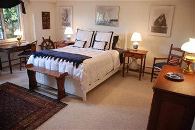 138 Stage Island Road Chatham, MA 02633 - Photo 15 of 19 a bedroom with furniture and a wooden floor