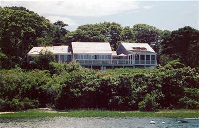 138 Stage Island Road Chatham, MA 02633 - Photo 3 of 19 a view of a house with a yard and potted plants