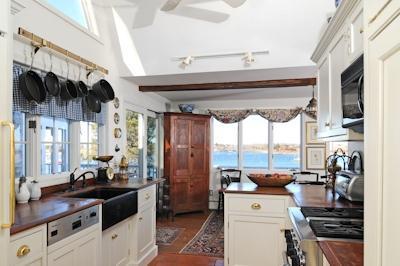 138 Stage Island Road Chatham, MA 02633 - Photo 6 of 19 a kitchen with stainless steel appliances a stove a table and chairs