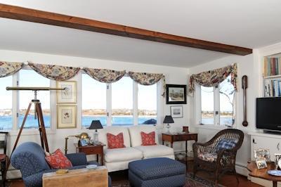 138 Stage Island Road Chatham, MA 02633 - Photo 8 of 19 a living room with furniture a flat screen tv and a large window