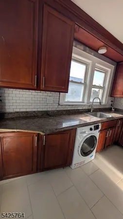 a view of kitchen and utility room