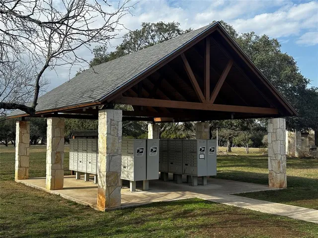 a backyard of a house with barbeque oven