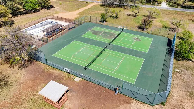 an aerial view of a tennis ground