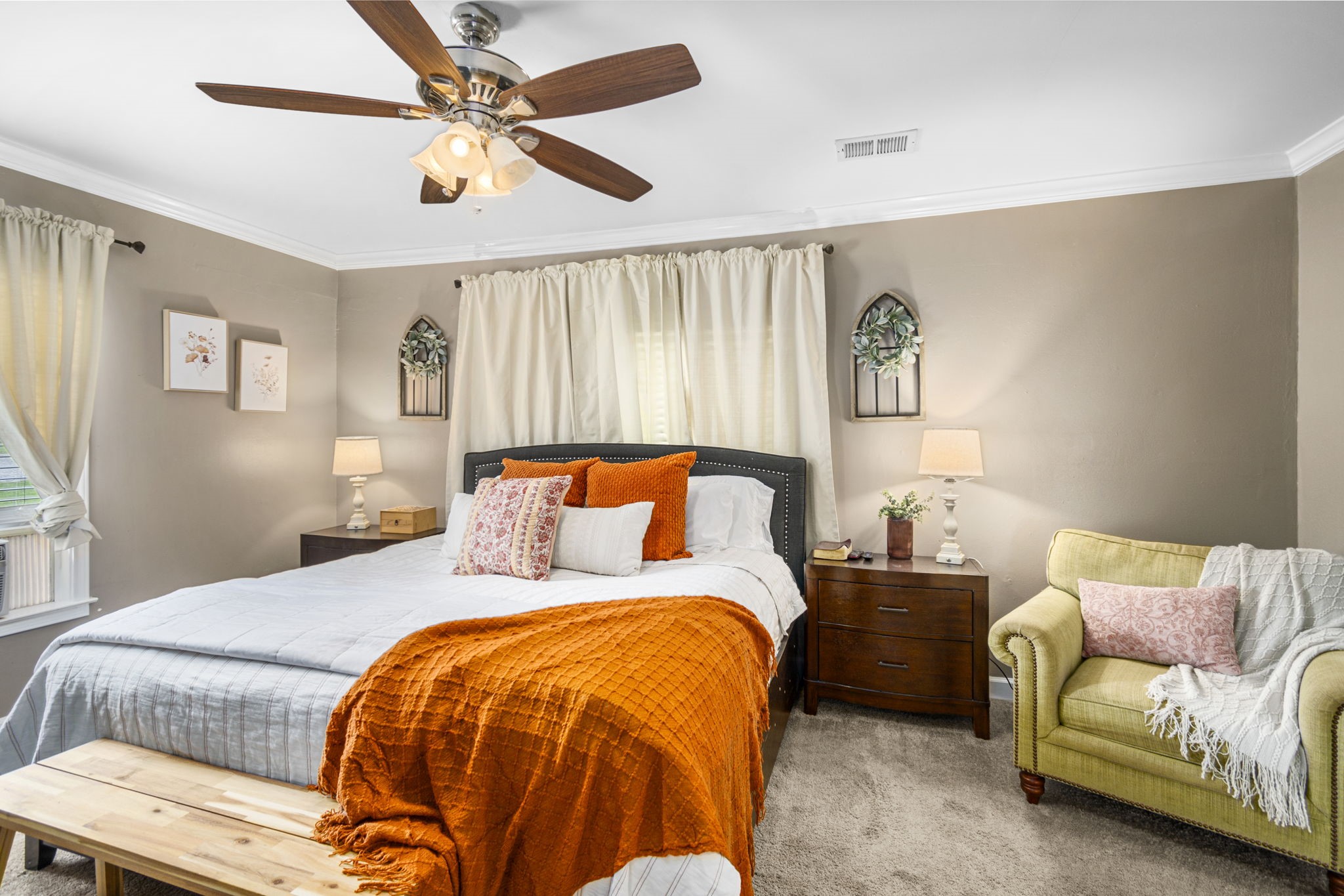 25311 Hardin Store Road Pinehurst, TX 77362 - Photo 12 of 39 a bedroom with a bed and a chandelier