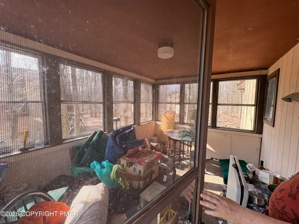 a living room with furniture and a window