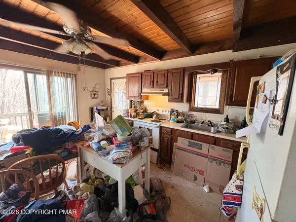 a open kitchen with stainless steel appliances granite countertop a stove sink and cabinets