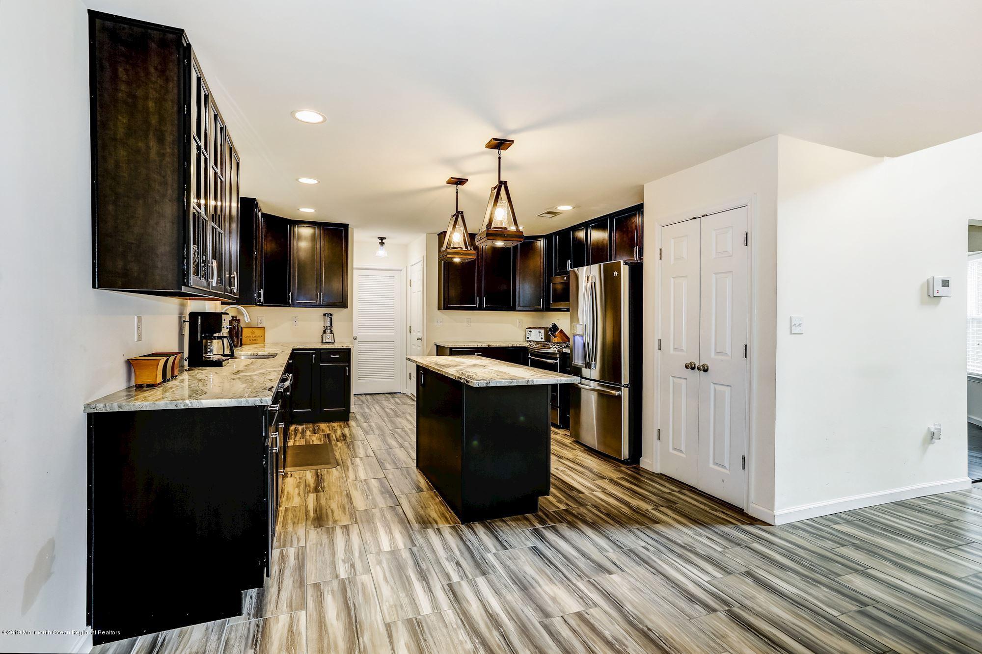 20 Pasadena Road Whiting, NJ 08759 - Photo 12 of 60 a kitchen with a refrigerator and a sink