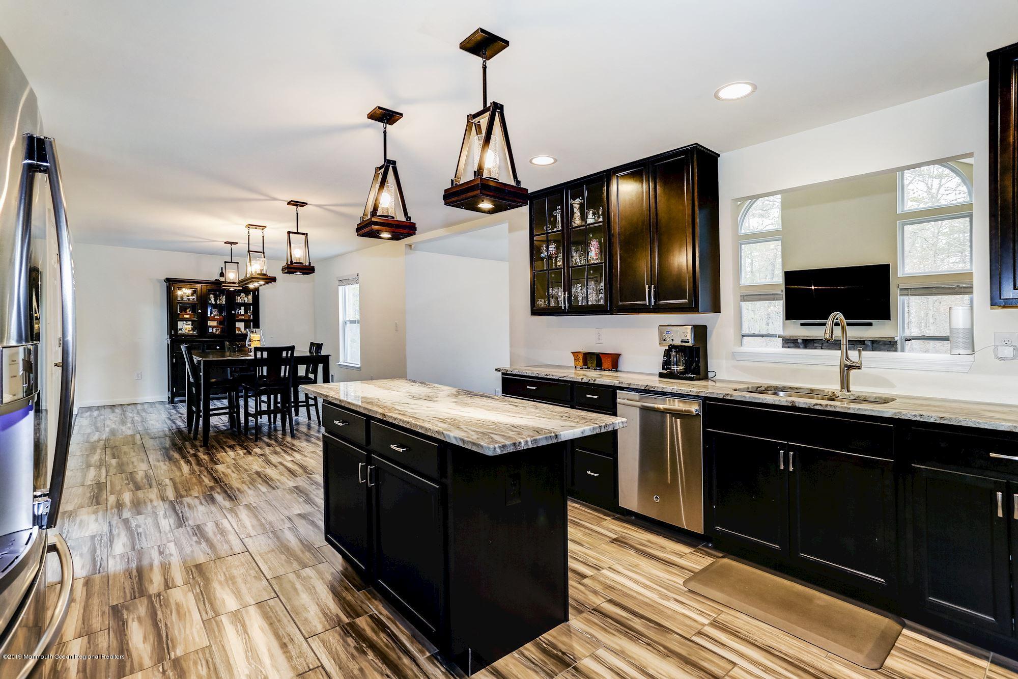20 Pasadena Road Whiting, NJ 08759 - Photo 15 of 60 a kitchen with granite countertop a sink appliances and wooden floor