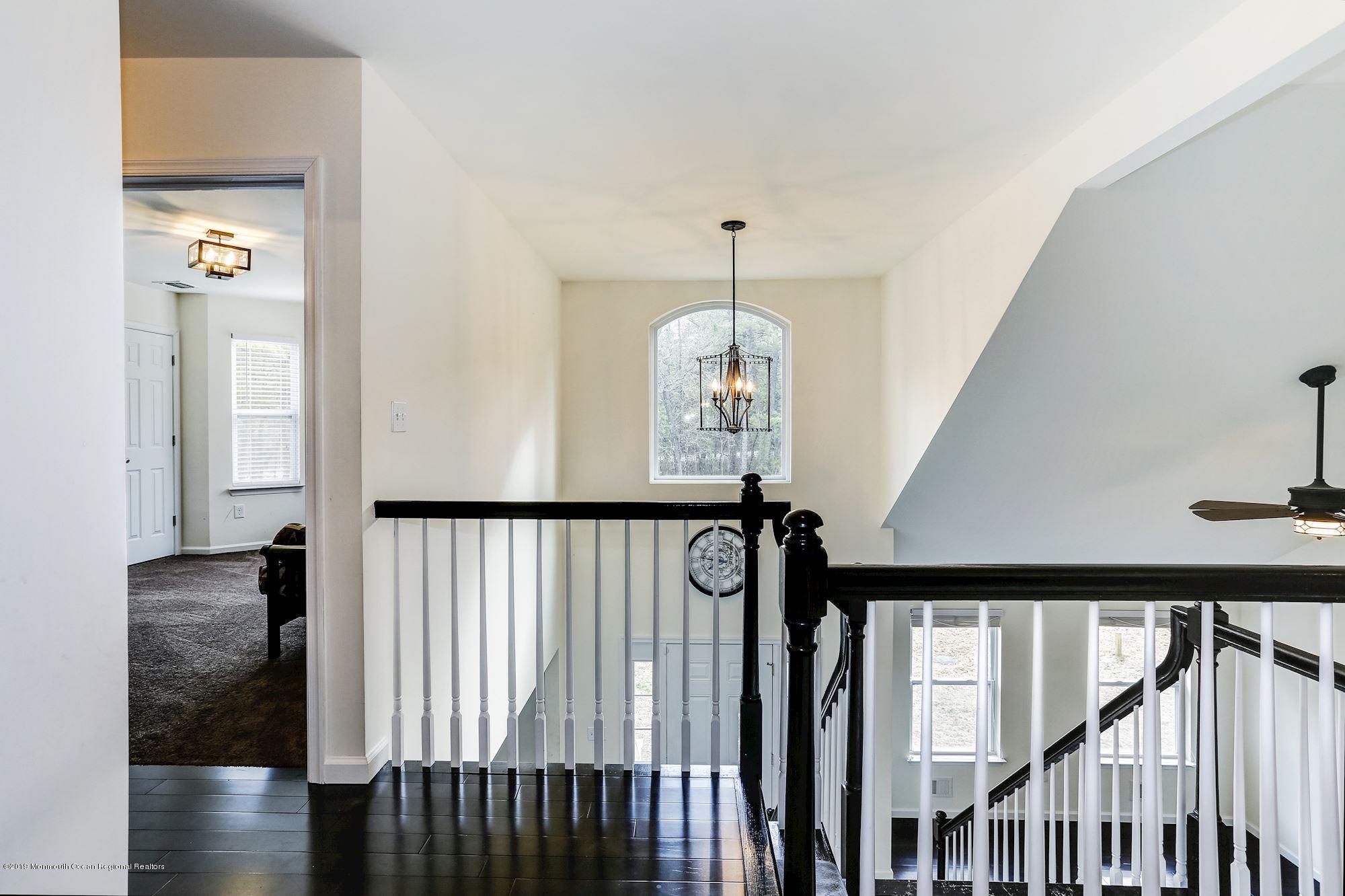 20 Pasadena Road Whiting, NJ 08759 - Photo 29 of 60 a view of a hallway with wooden floor and staircase