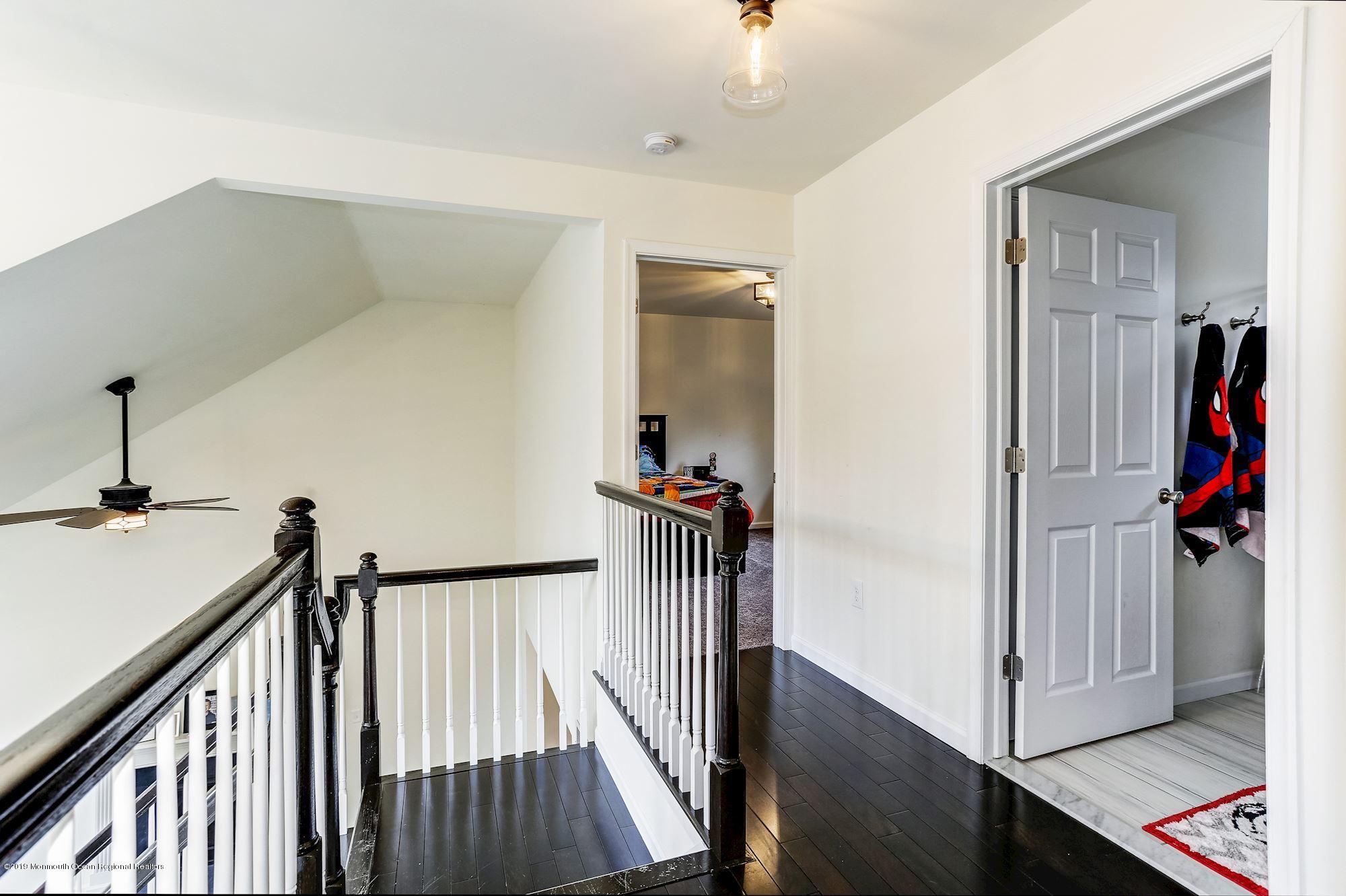 20 Pasadena Road Whiting, NJ 08759 - Photo 30 of 60 a view of a hallway with wooden floor and staircase