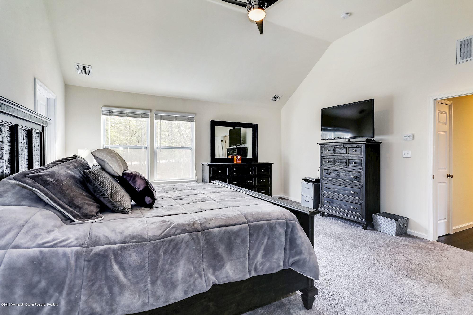 20 Pasadena Road Whiting, NJ 08759 - Photo 34 of 60 a bedroom with a bed and a television