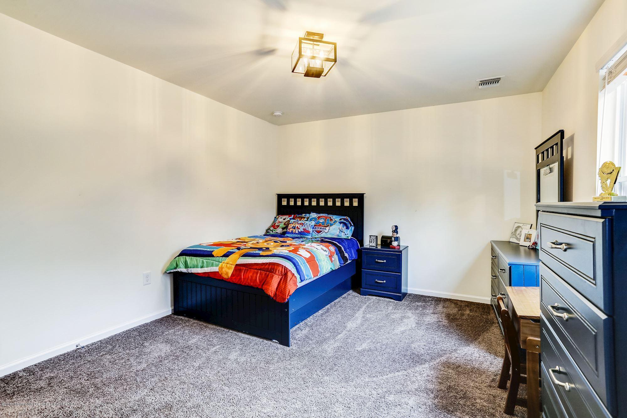 20 Pasadena Road Whiting, NJ 08759 - Photo 43 of 60 a bedroom with a bed and a tv on the dresser