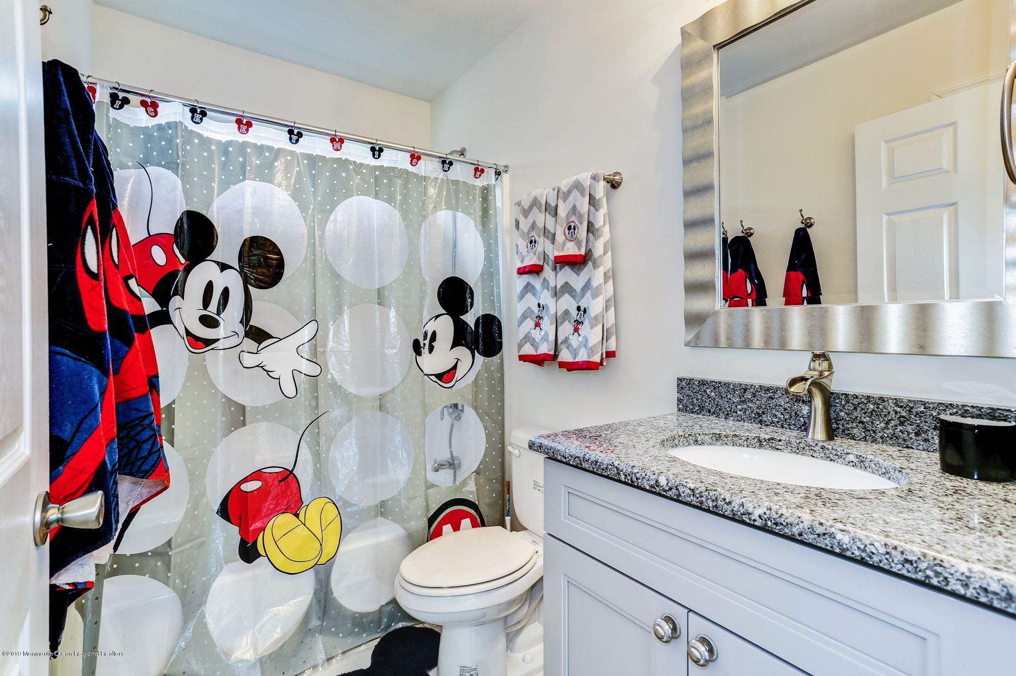 20 Pasadena Road Whiting, NJ 08759 - Photo 44 of 60 a bathroom with a sink mirror and toilet