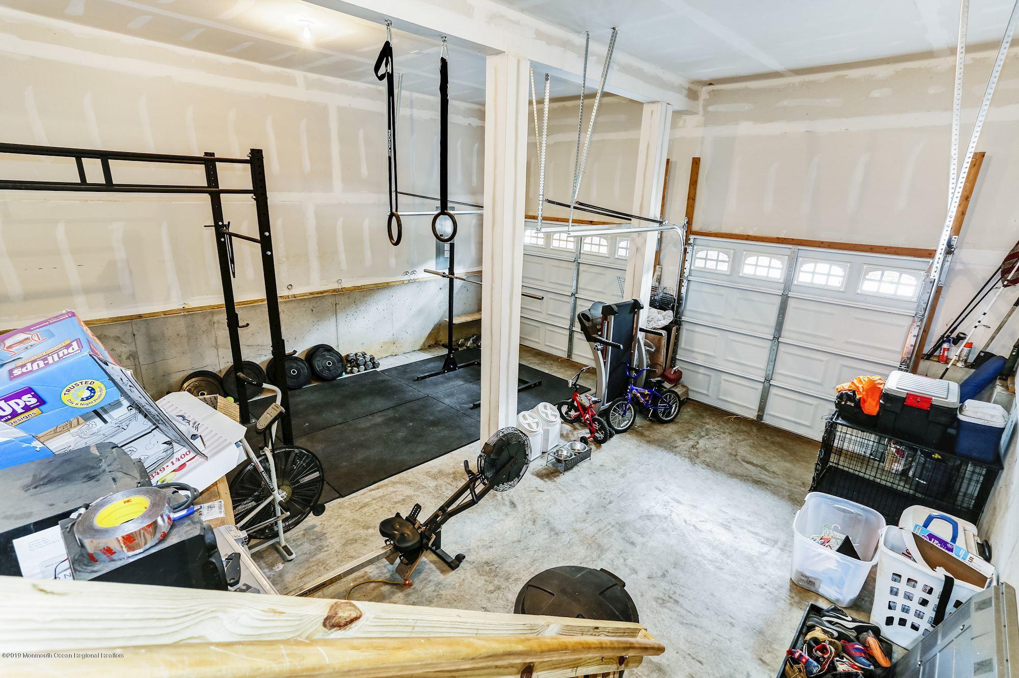 20 Pasadena Road Whiting, NJ 08759 - Photo 51 of 60 a room with gym equipment and a mirror