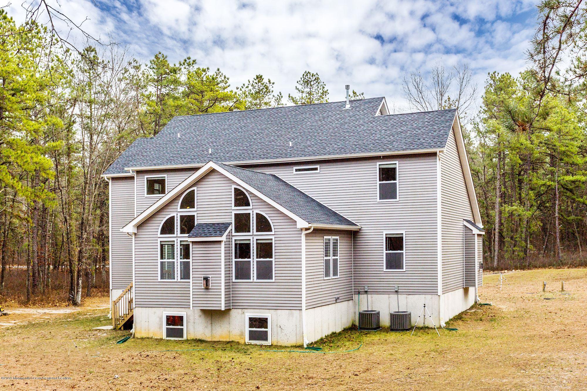 20 Pasadena Road Whiting, NJ 08759 - Photo 56 of 60 a view of a white house with a yard