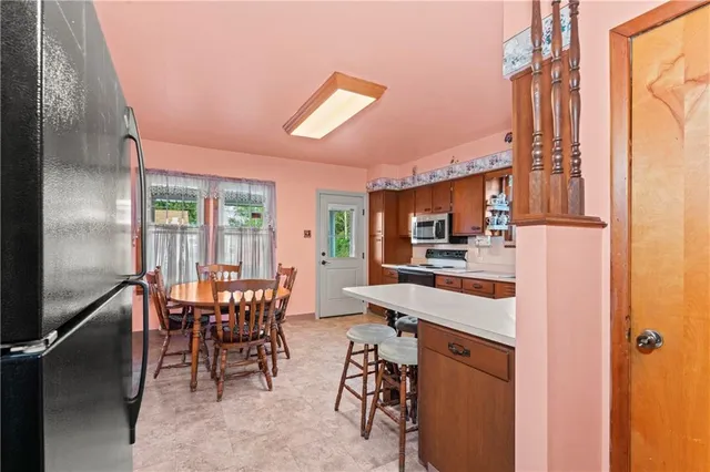 a view of a dining room with furniture window and outside view