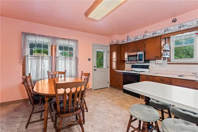 a dining room with furniture and window