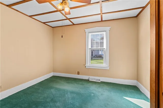 a view of a room that has a window in it