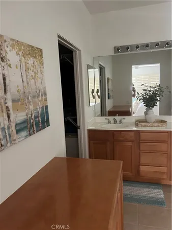 a bathroom with a sink and mirror