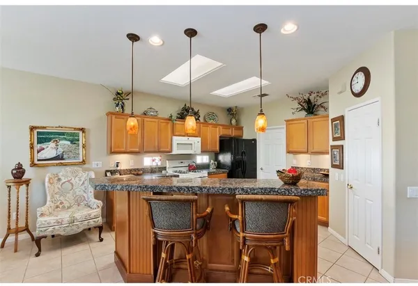 a kitchen with a table and chairs in it