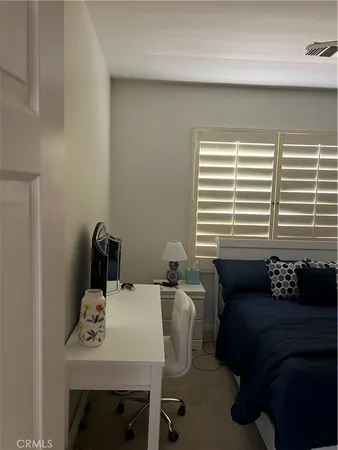 a dining room with furniture and a window