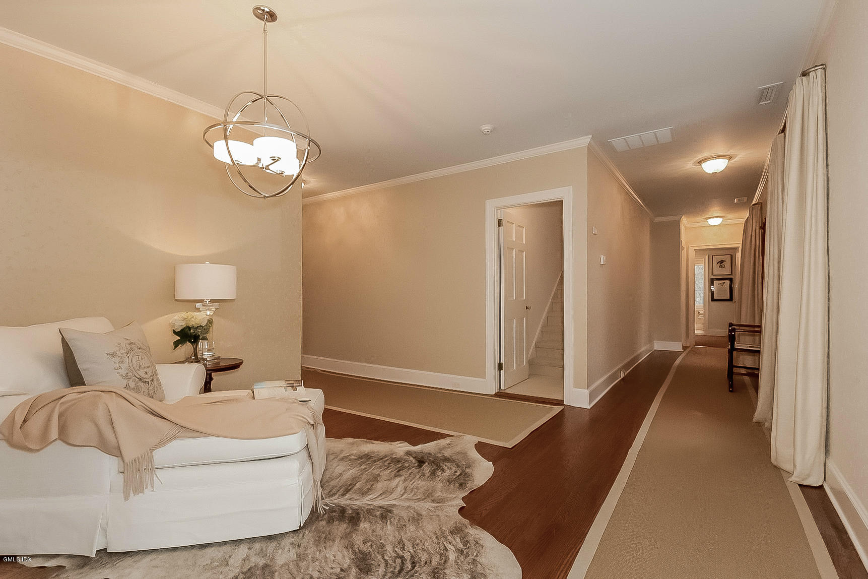 200 Stanwich Road Greenwich, CT 06830 - Photo 12 of 18 a living room with furniture chandelier and a table