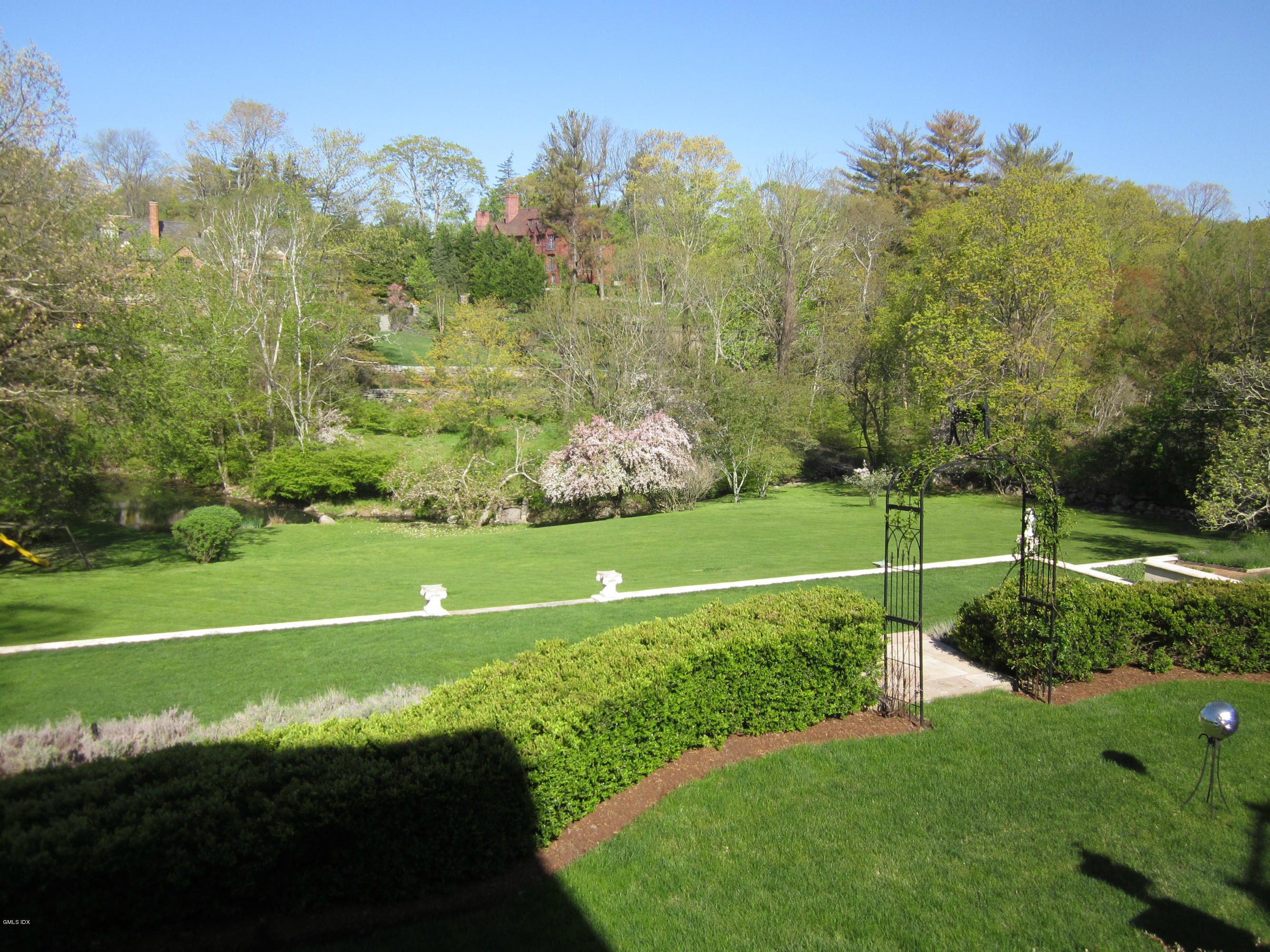 200 Stanwich Road Greenwich, CT 06830 - Photo 17 of 18 a view of a golf course with a garden