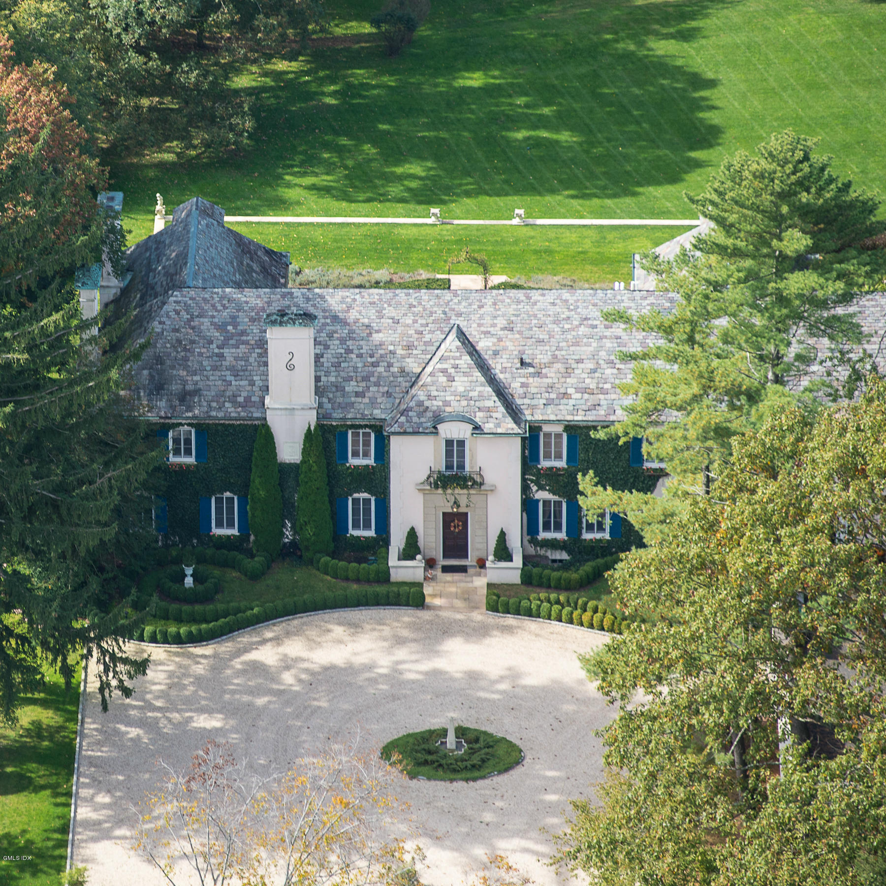 200 Stanwich Road Greenwich, CT 06830 - Photo 3 of 18 a front view of a house with garden