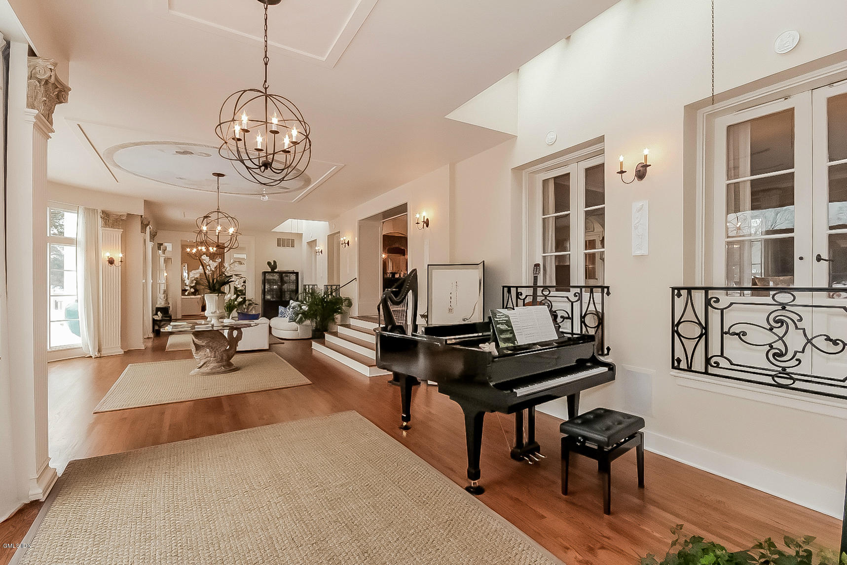 200 Stanwich Road Greenwich, CT 06830 - Photo 8 of 18 a view of a livingroom and kitchen area with a table chairs