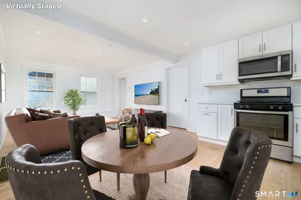a kitchen with granite countertop a stove and a sink