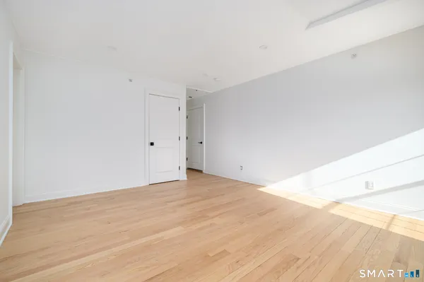 a bedroom with a large bed and a couch