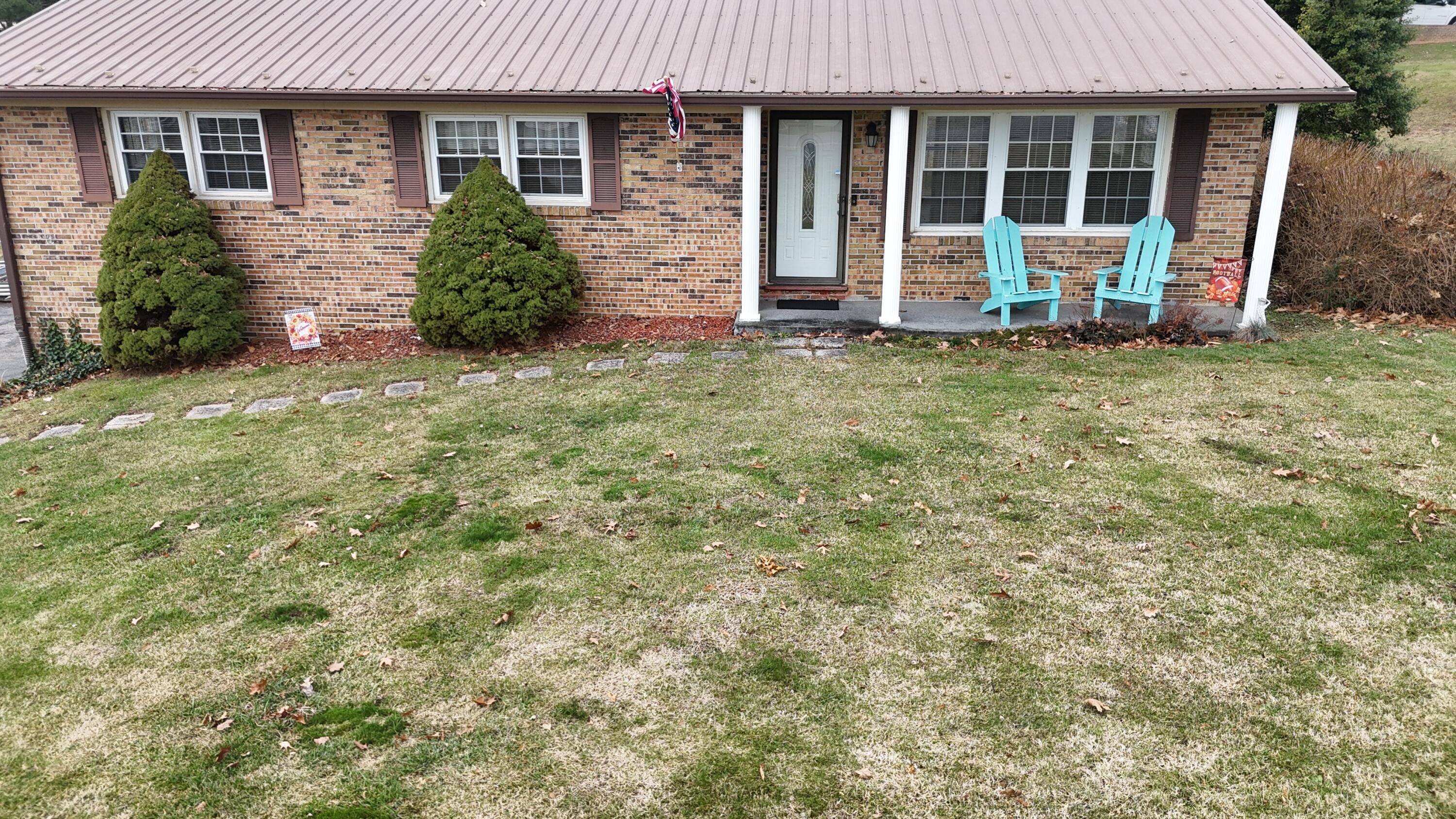 front view of a house with a yard