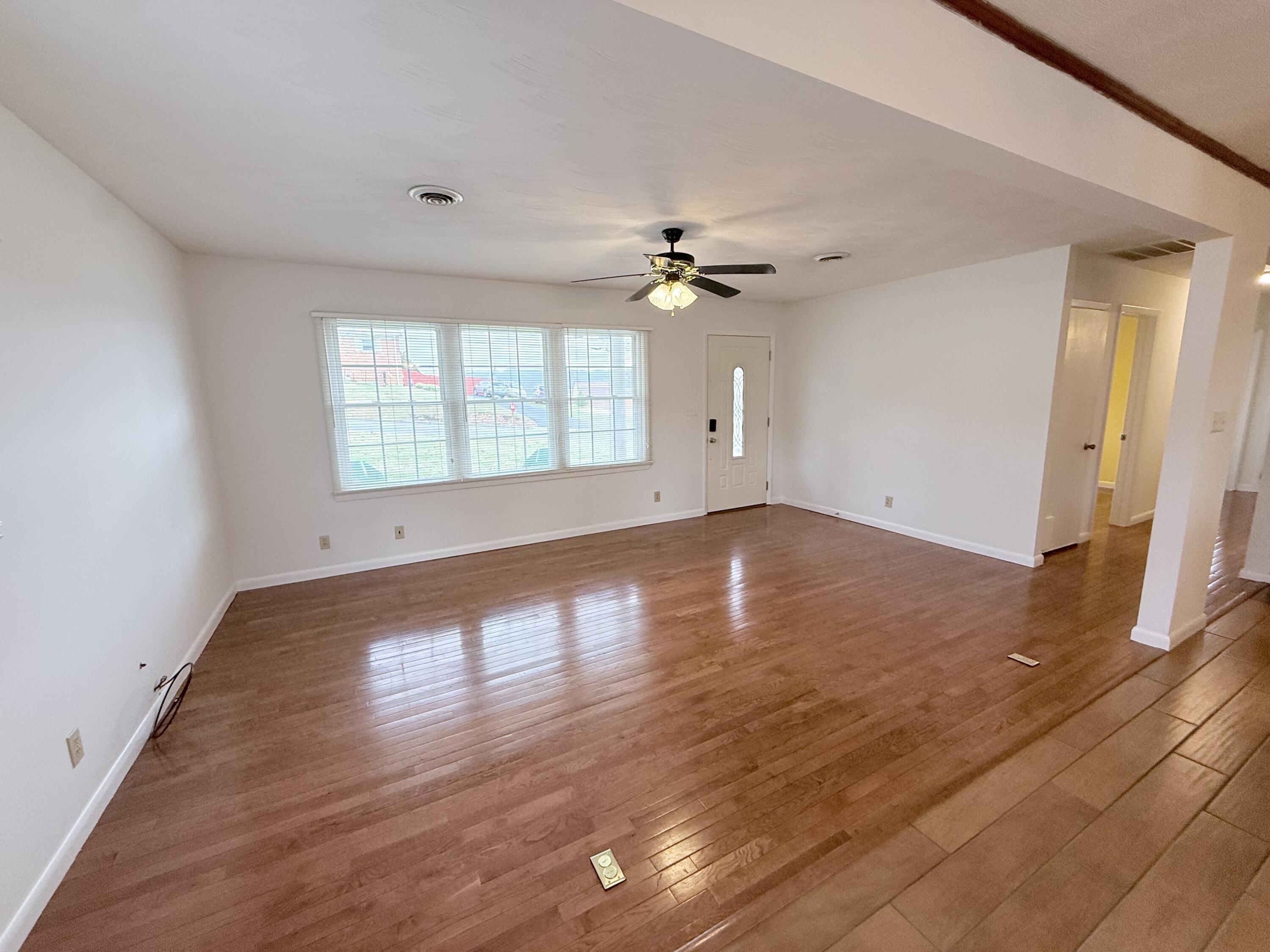 448 Baughman Avenue Marion, VA 24354 - Photo 14 of 43 wooden floor in an empty room with a window