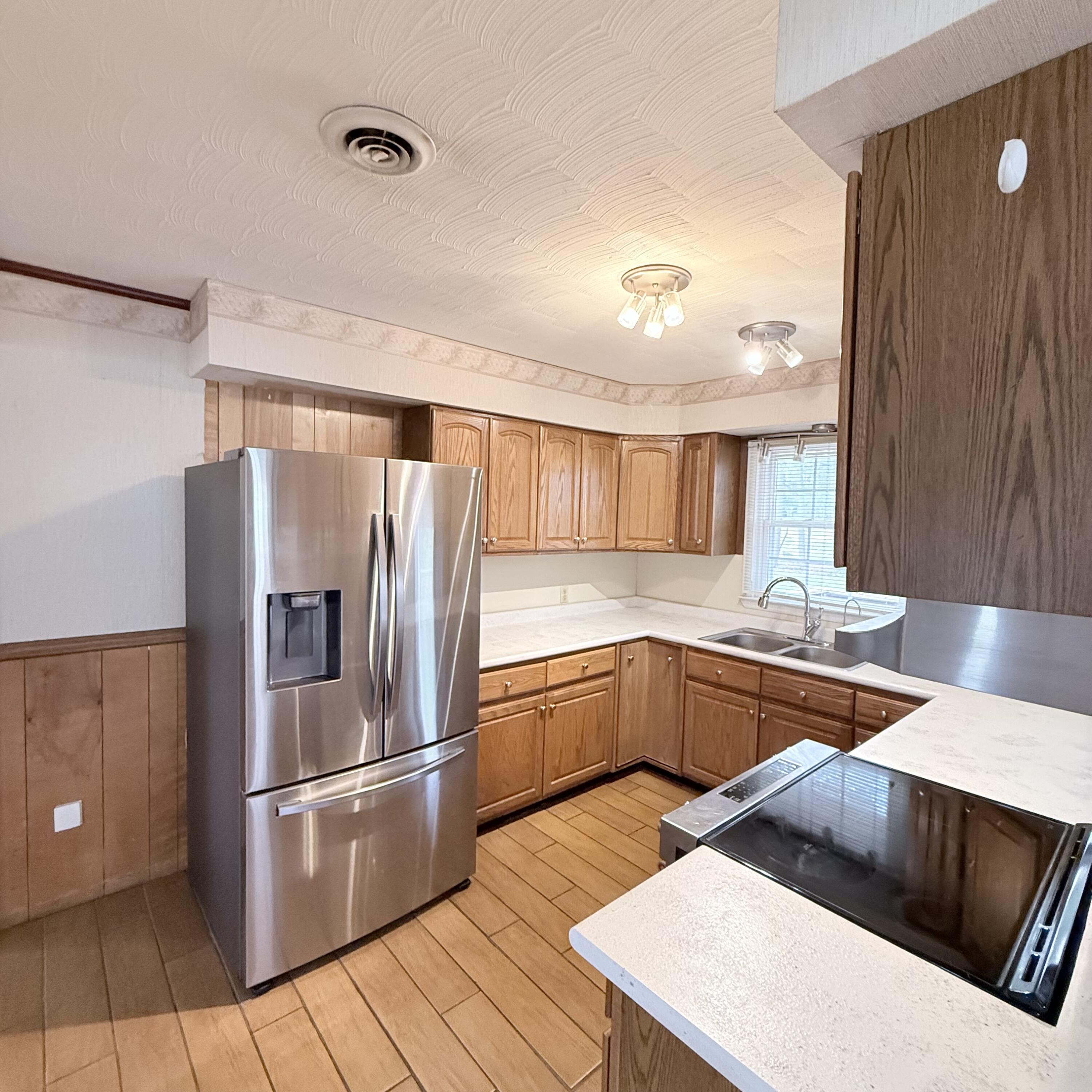 448 Baughman Avenue Marion, VA 24354 - Photo 17 of 43 a kitchen with stainless steel appliances a refrigerator sink and cabinets