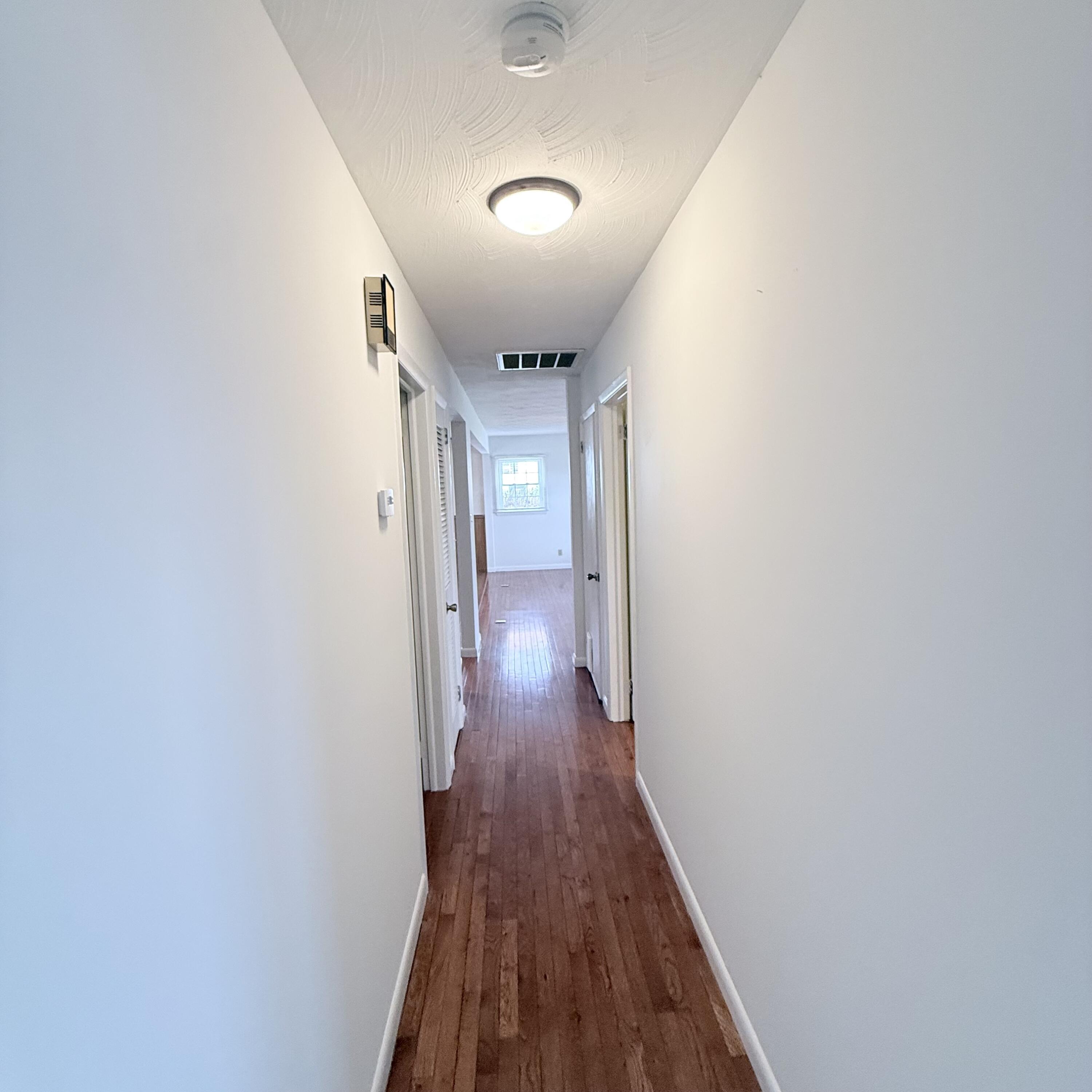 448 Baughman Avenue Marion, VA 24354 - Photo 18 of 43 a view of a hallway with wooden floor