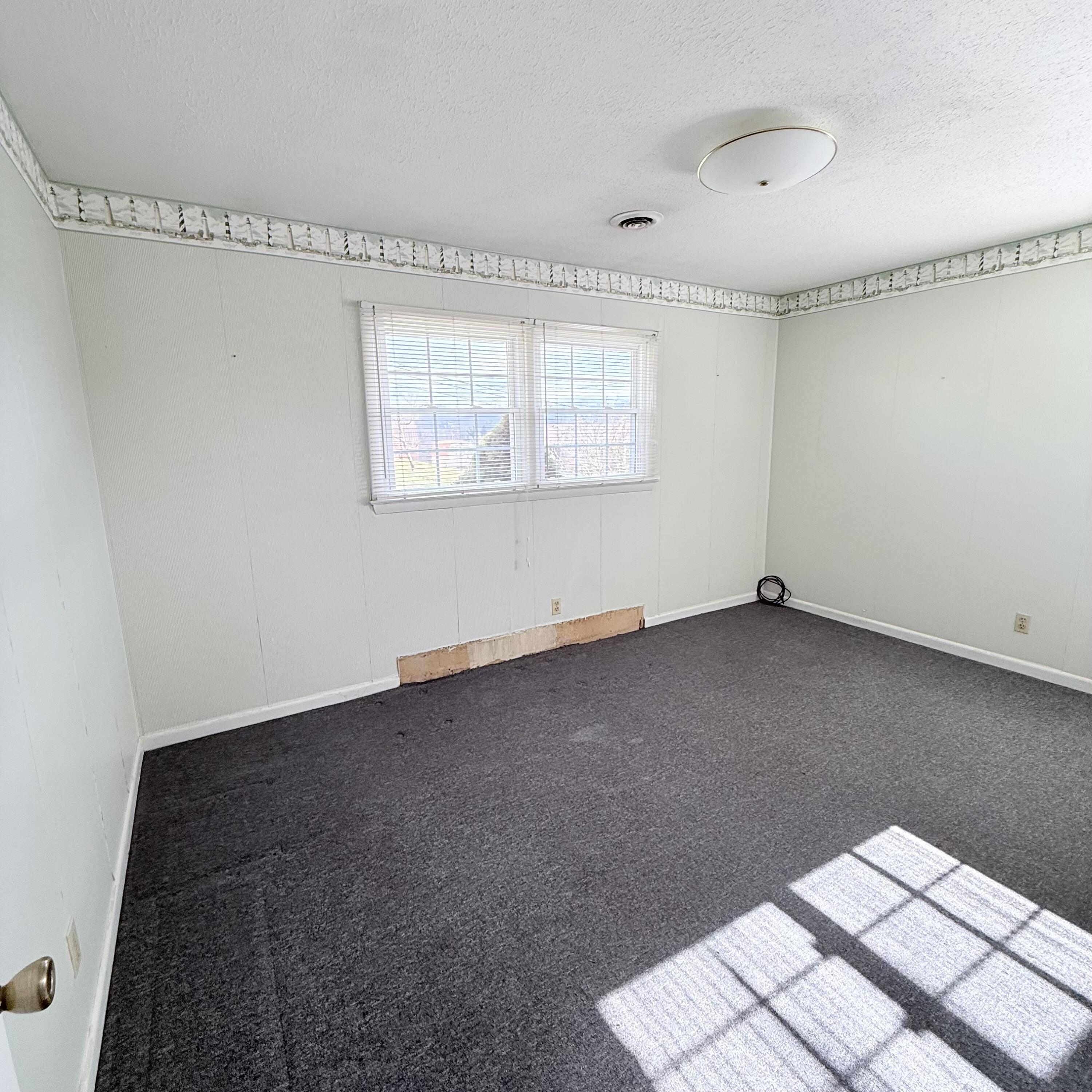 448 Baughman Avenue Marion, VA 24354 - Photo 24 of 43 a view of an empty room with a window