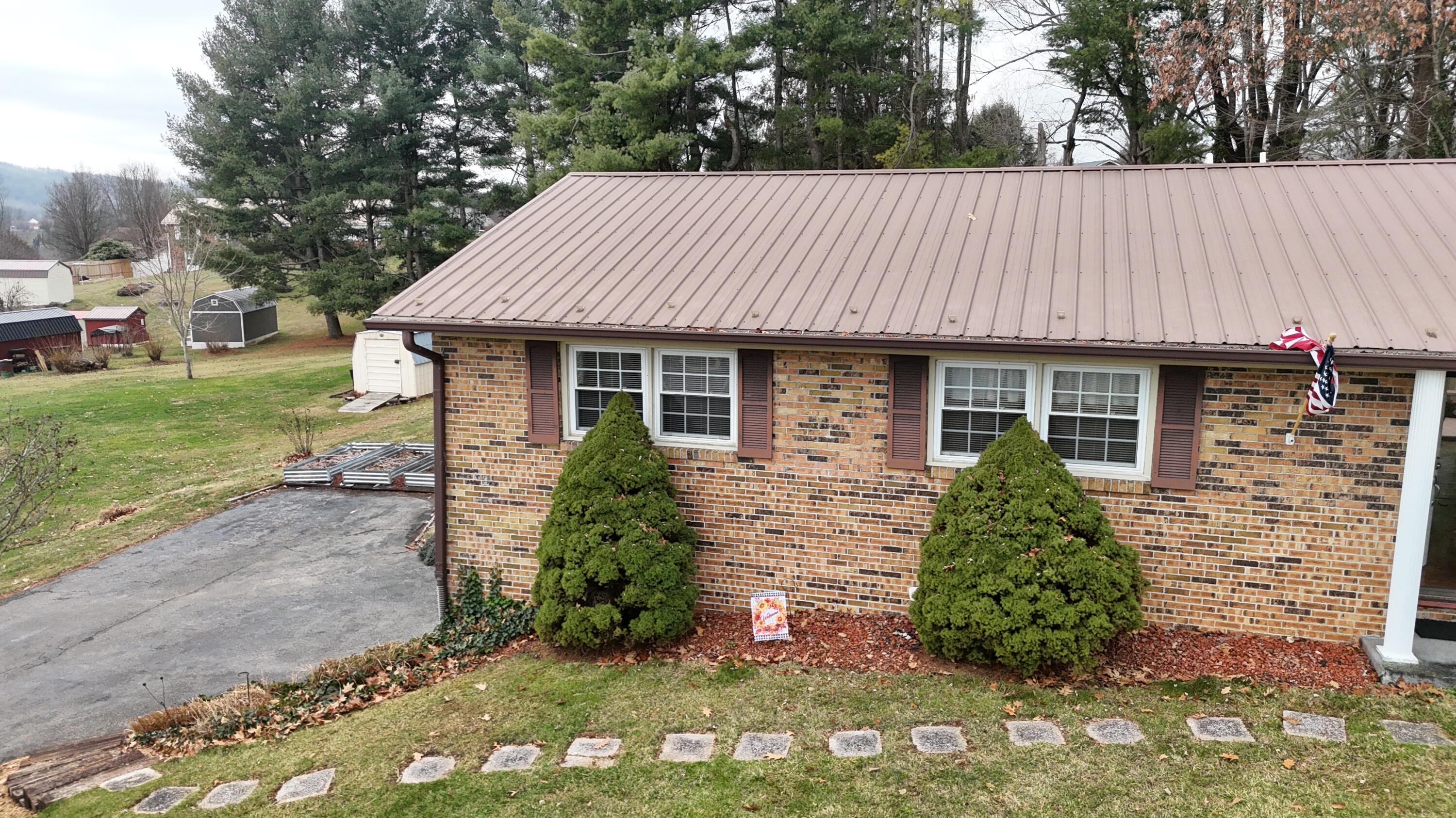 448 Baughman Avenue Marion, VA 24354 - Photo 4 of 43 a view of a house with a yard and sitting area