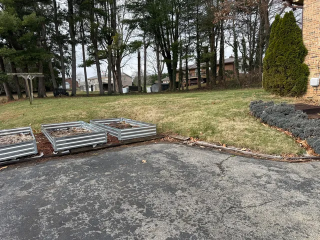 a view of a house with backyard and porch