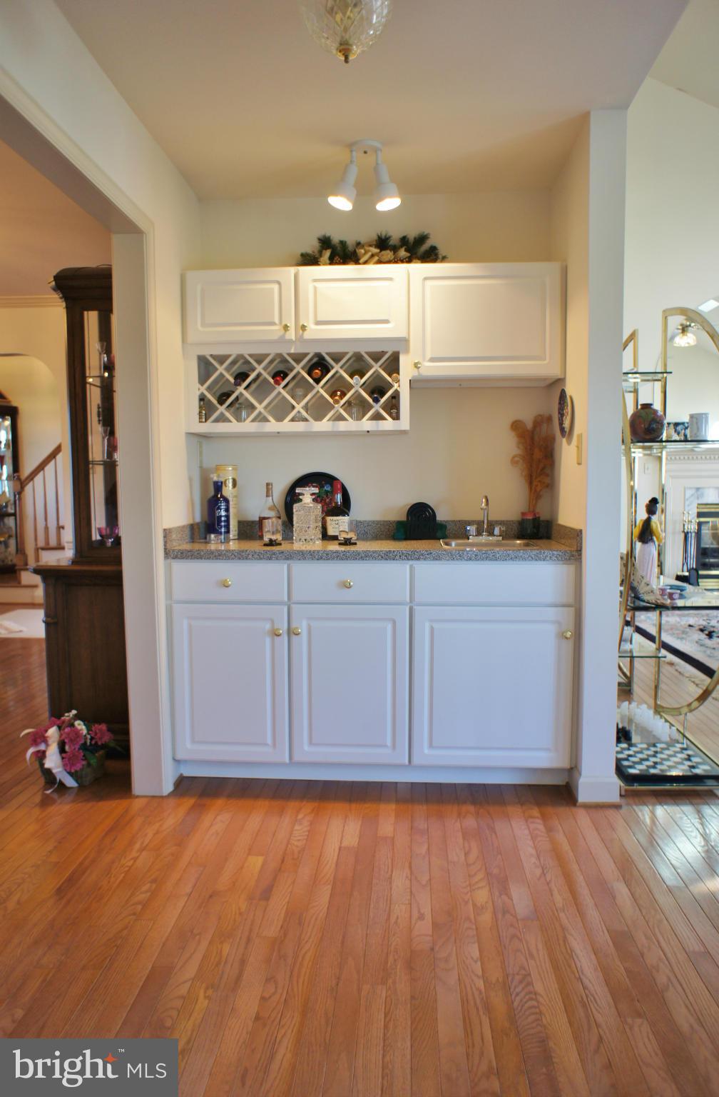 5971 Ketch Road Prince Frederick, MD 20678 - Photo 12 of 30 a view of a kitchen with wooden floor and cabinets