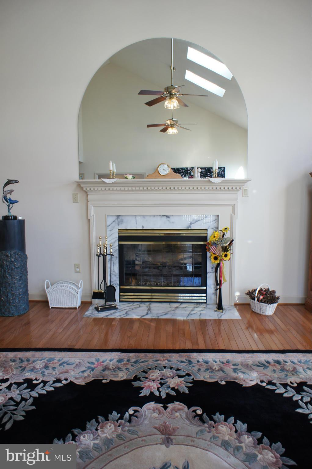 5971 Ketch Road Prince Frederick, MD 20678 - Photo 14 of 30 a living room with furniture and a fireplace