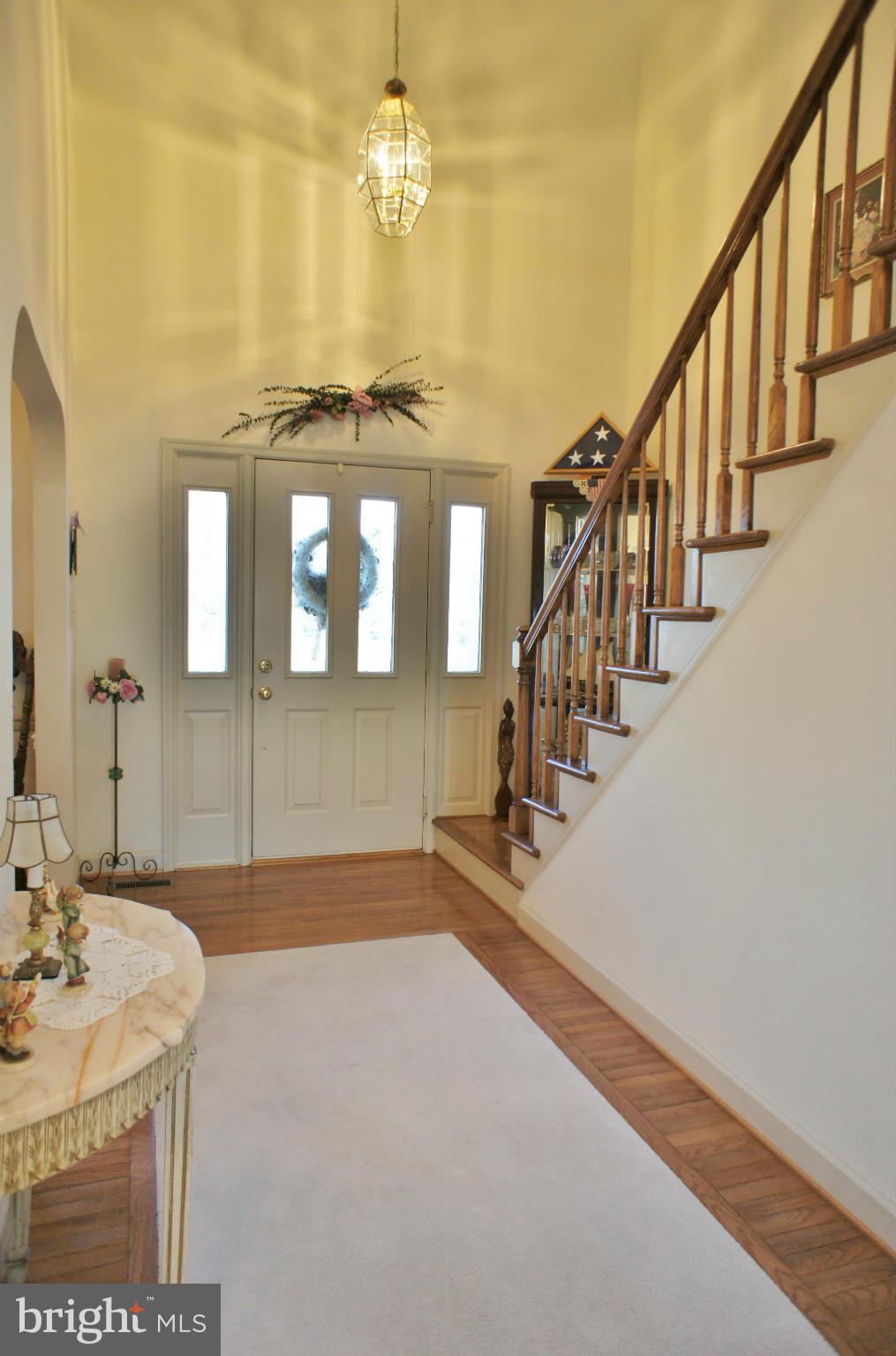5971 Ketch Road Prince Frederick, MD 20678 - Photo 3 of 30 a view of a hallway with wooden floor and staircase