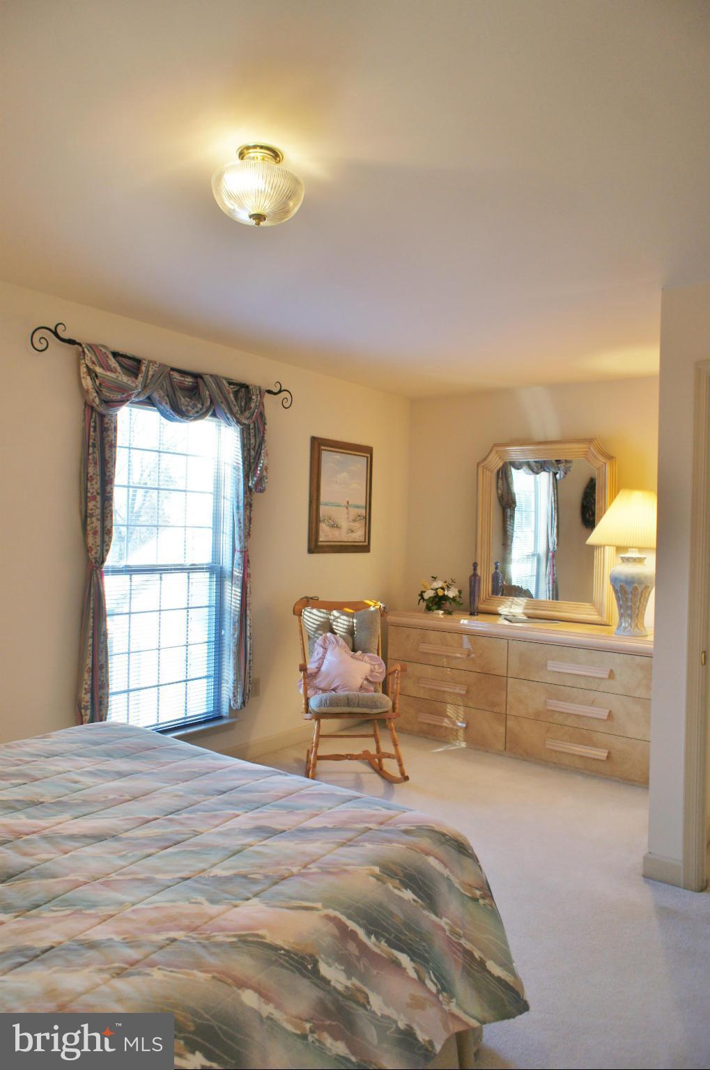 5971 Ketch Road Prince Frederick, MD 20678 - Photo 22 of 30 a bedroom with a bed and a window
