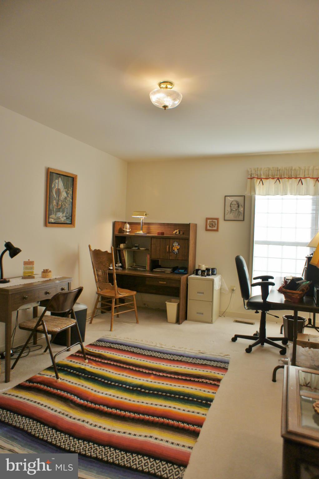 5971 Ketch Road Prince Frederick, MD 20678 - Photo 23 of 30 a living room with furniture and a piano